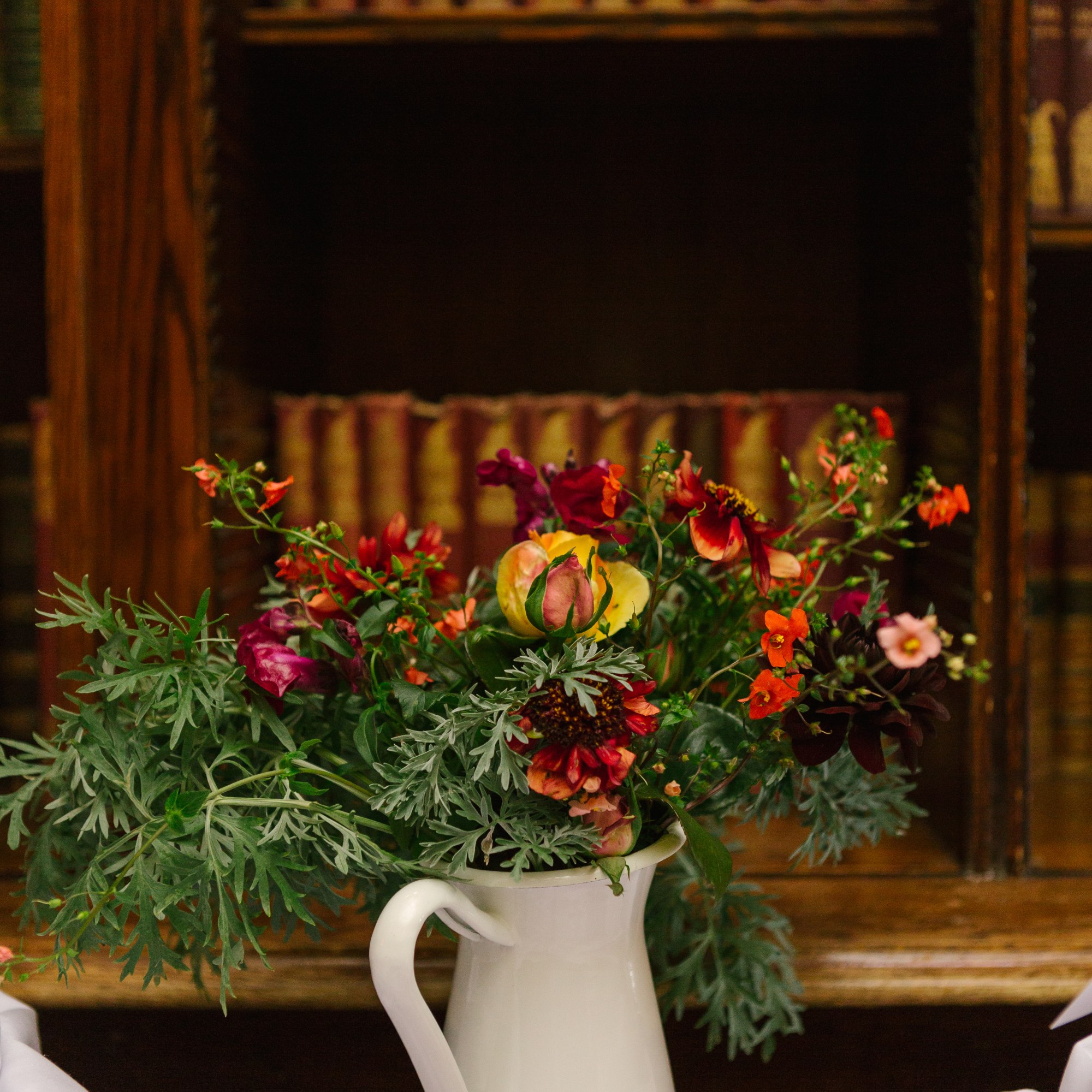 Seasonal Autumn flowers in white jug